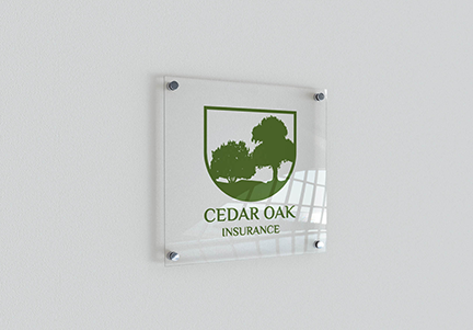 Cedar Oak Insurance Logo attached on a glass frame